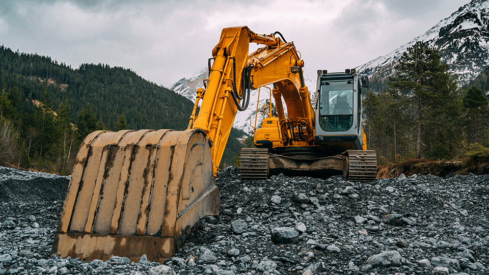 Construction machine shoveling dirt